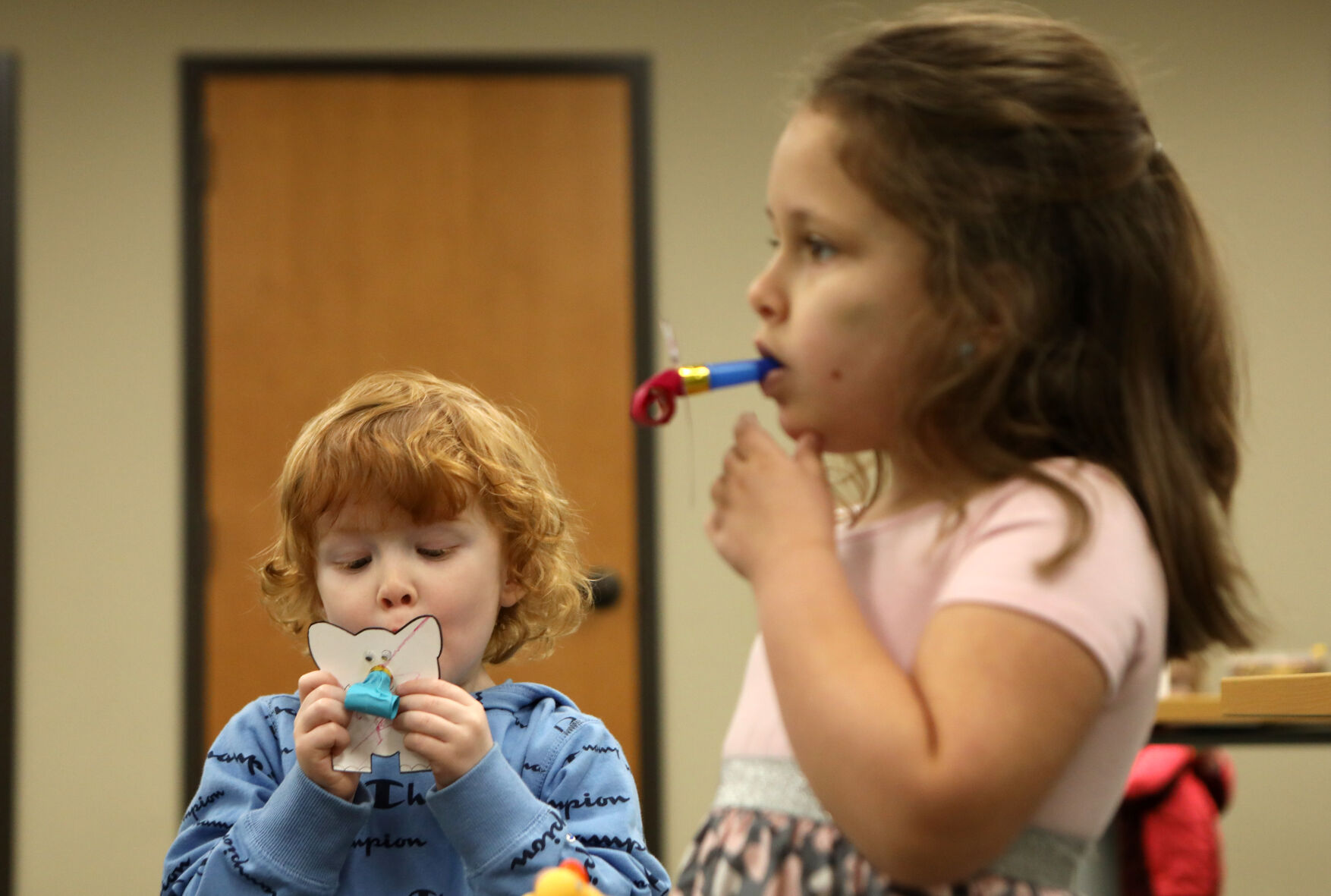 Oliver and Jordyn Cummins test noisemakers